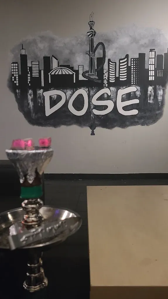 The DOSE wall mural — the Toronto skyline with the CN Tower drawn as a hookah